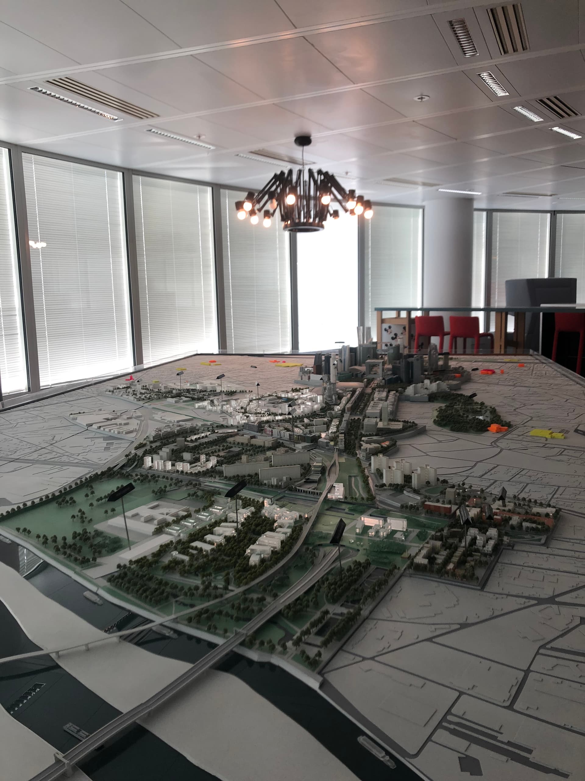 Large-scale urban architectural model equipped with micro-screens and markers in an office space