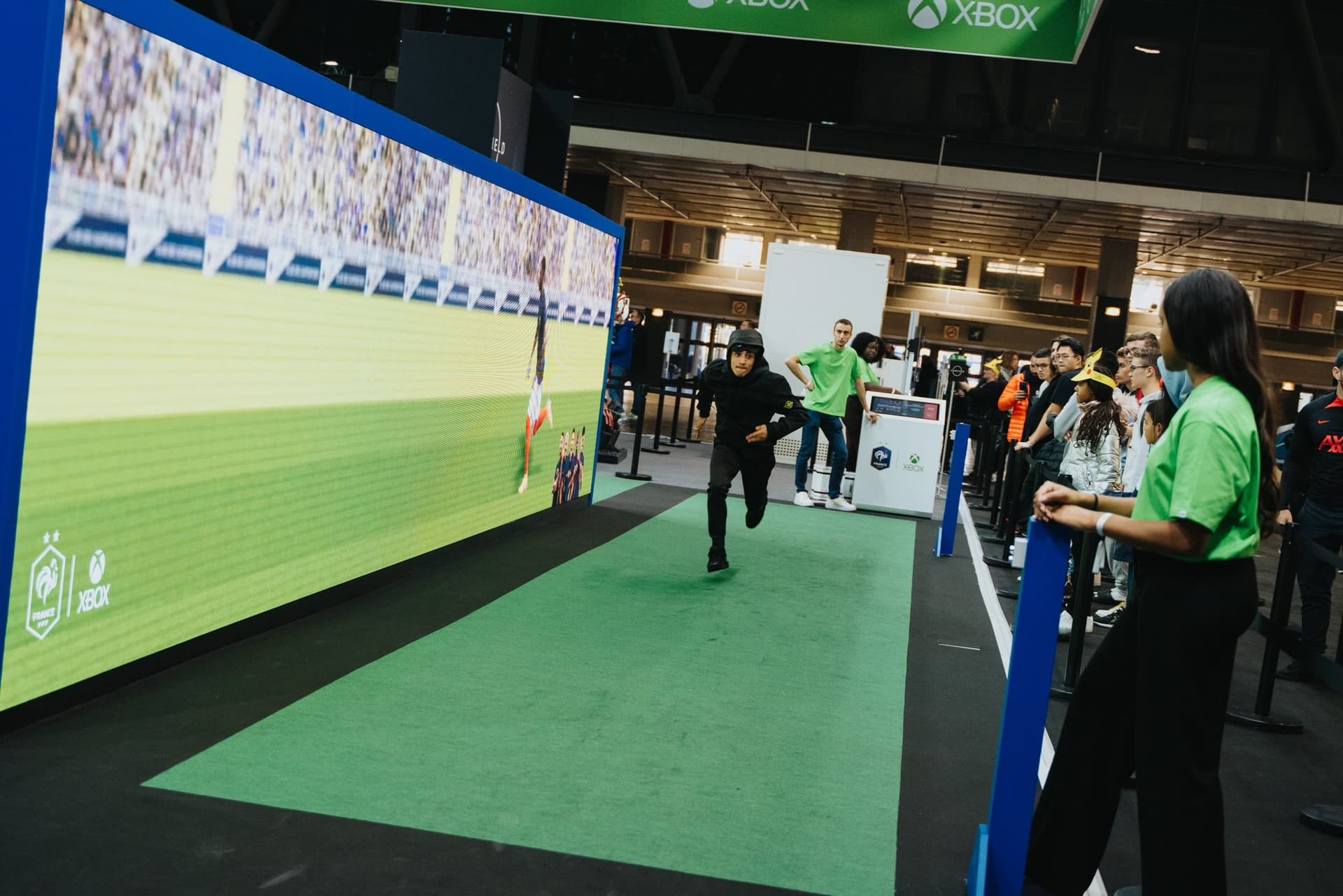 Interactive running installation along a giant LED wall at a public event